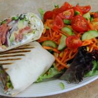Smoked Salmon Wrap · Romaine lettuce hearts, smoked salmon, cream cheese, red onions, capers and avocado wrapped ...
