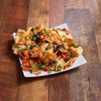 Ultimate Nachos Appetizer · Tortilla chips smothered with cheese, refried beans, enchilada sauce, jalapenos, tomatoes, b...