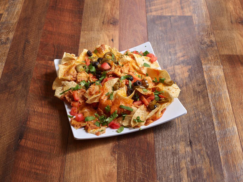 Ultimate Nachos Appetizer · Tortilla chips smothered with cheese, refried beans, enchilada sauce, jalapenos, tomatoes, black olives, sour cream and guacamole.
