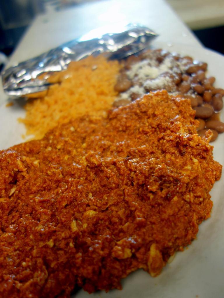 Chorizo and Eggs · Choice of tortillas, tomato rice and refried beans.