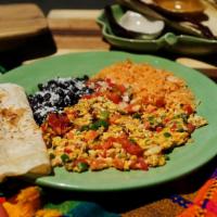 Huevos a la Mexicana · Eggs, green chile, tomatoes, onions, choice of tortillas, tomato rice and refried beans.