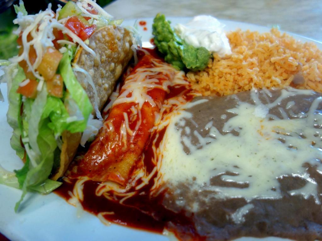 Crispy Tacos · Choice of meat, choice of beans, tomato rice, guacamole and sour cream.
