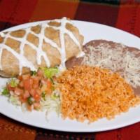 Chimichanga · Deep fried burrito stuffed with choice of meat and cheese. Tomato rice, beans, sour cream, g...