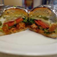 Classic Tortas · Toasted bolillo. Choice of meat. Guacamole, refried beans, sour cream, lettuce, onion and to...