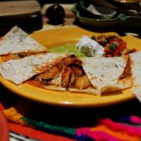 Cheese Quesadilla · A large flour tortilla filled with cheese and served with sour cream and guacamole.