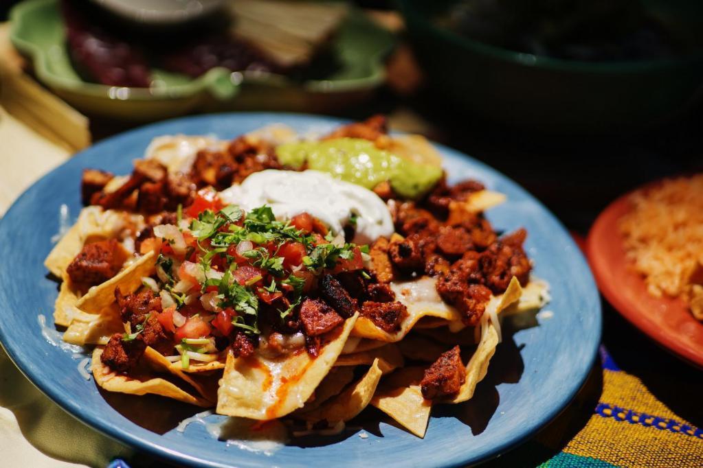 Classic Nachos · Choice of meat. Cheese, sour cream, refried beans, guacamole, salsa fresca and jalapenos.