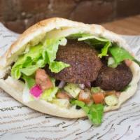 Falafel Pita Pocket · Fried chickpea and parsley patty seasoned with our special spices, topped with romaine lettu...