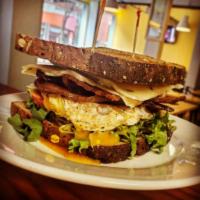 #8 Ultimate BLT · Bacon, lettuce, tomato, pepper Jack cheese avocado on a over-easy egg and chipotle aioli.