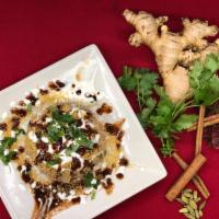 Aloo Papri Chaat · A delicious combination of crispies, boiled potatoes, and chickpeas, topped with yogurt, fre...