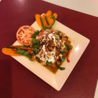 15. Samosa Chat · Two pieces of samosa served with chickpeas and topped with yogurt, fresh tamarind sauce and ...