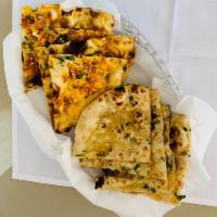 30. Onion Kulcha · Finely chopped onions mixed with spices and baked with fresh dough.