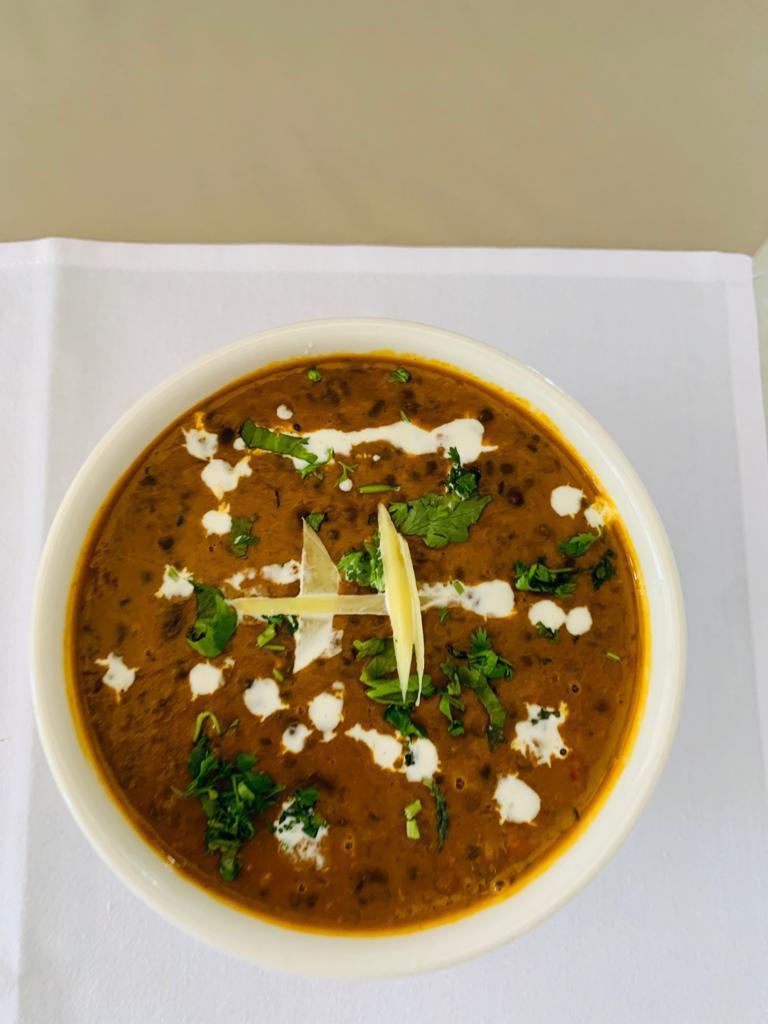 57. Dal Makhani · Creamed lentils delicately cooked on low heat and garnished with fresh cream.