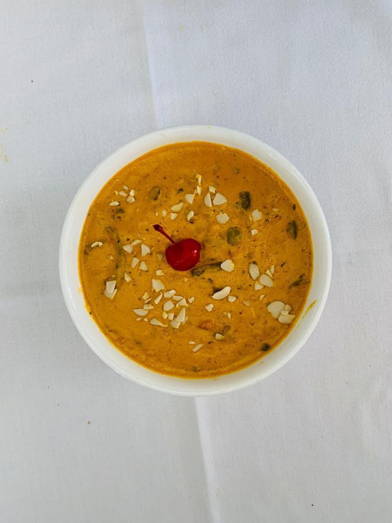Navratna Korma · Mixed vegetables cooked in mild curry sauce, garnished with dry fruits.