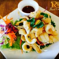 Fried Calamari · Fried lightly and hand dusted in a seasoned coating with a hint of garlic and herbs calamari...