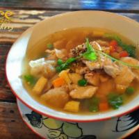 Wonton Soup · Ground marinated pork stuffed in wonton in house soup with baby corn, pea and carrot. 