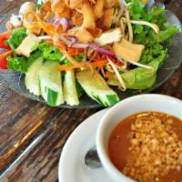 Thai Salad · Romaine, cucumber, tomato, broccoli, mushroom, red onion, bean sprout and tofu served with T...