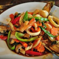 Flaming Seafood · Platter of shrimp, squid, mussel, scallop and crab spicy stir-fried with lemongrass and Thai...