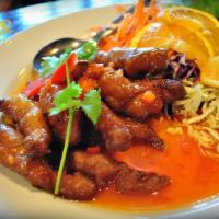 Orange Chicken · Lightly battered marinated chicken flash fried served with homemade style tangy orange sauce. 