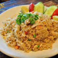 Crab Fried Rice · Real crab meat stir-fried with rice, egg, pea, carrot and onion. 