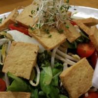 10. Tofu Salad · Fried tofu, bean sprout, lettuce, cucumber, tomato and peanut sauce.