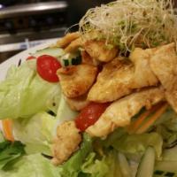 11. Chicken Salad · Grilled chicken, lettuce, cucumber, tomato and carrots with duo dressing on the side.