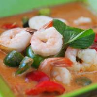 48. Red Curry · Coconut milk with red curry paste, bell pepper, eggplant, bamboo shoot and basil leaves.
