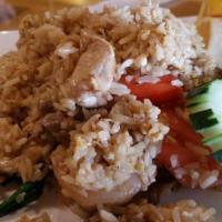 56. Basil Fried Rice · Stir-fried rice, onion, scallion, bell pepper, mushroom and basil leaves with basil sauce.