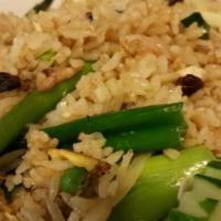 63. Crab Fried Rice · Stir-fried egg, rice, onion, scallion, crabmeat, raisins and sweet peas with brown sauce.