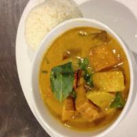52. Yellow Curry · Coconut milk with yellow curry paste, bell pepper, potato, eggplant and basil leaves.