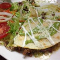 QUESADILLA · HANDMADE CORN TORTILLA, LETTUCE, PICO DE GALLO, CREAM, GUACAMOLE AND CHEESE.