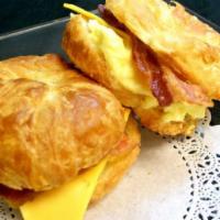 Croissant Bacon Egg and Cheese   · Fried egg with bacon and melted cheese on a lightly toasted croissant. 