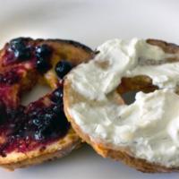 Toasted bagel with cream cheese and jelly · Your choice of bagel toasted with a generous portion of cream cheese and grape jelly.