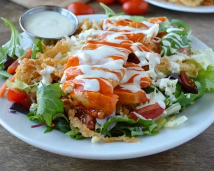 Buffalo Chicken Salad · Buffalo chicken, romaine lettuce, cucumber, tomatoes, served with blue cheese dressing.