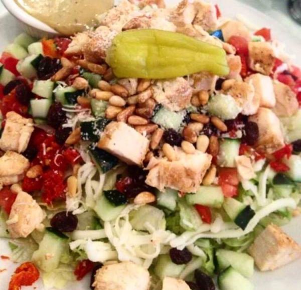 Special Chopped Salad with Chicken · Grilled chicken, sun-dried tomatoes, toasted almonds, raisins, Roma tomatoes, cucumbers. Mozzarella cheese, Parmesan cheese, pepperoncini. House-made balsamic vinaigrette.
