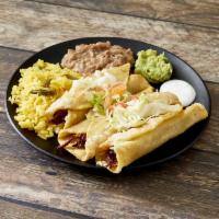 #8. Flautas · Three corn tortillas rolled with choice of meat, fried and topped with guacamole and sour cr...