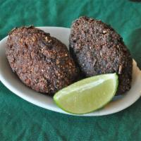 Kibe · A Brazilian-Arabian delicacy made with burghul wheat, ground beef and herbs.