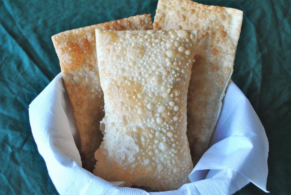 Pastel de Carne · Brazilian style beef empanada made with thin fried dough stuffed with ground beef.