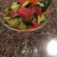 Tuna Poki · Raw tuna and cucumber with house special sauce.