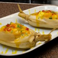 Tamal de Mango · Homemade corn tamales stuffed with cream goat cheese, chile chipotle and covered with fresh ...