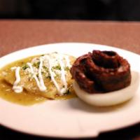 Carne Tampiqueña · Grilled skirt steak served with two cheese enchiladas covered with Zapata sauce. Comes with ...