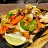New Rebozo Steak Fajitas · Grilled steak cooked with sizzling bell peppers, onion. With side of sour cream, guacamole a...