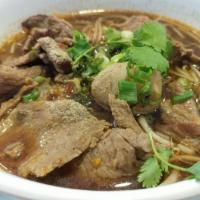Thai Boat Noodle Soup · Rice noodles in Thai style soup served with meat balls, bean sprouts and green onions. Spicy.