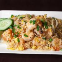 Thai Fried Rice · Pan fried rice with eggs, onions and tomatoes.