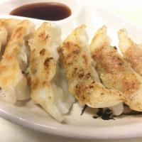 6 Pieces Gyoza · Pan fried chicken dumplings.
