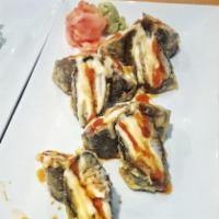 Spicy Volcano Roll (6pcs) · Deep Fried Sushi Roll with Imitation Crab and Tilapia. Drizzled with Siracha, Mayo, and Eel ...