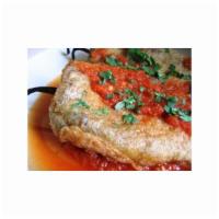 Chile Relleno · Poblano pepper filled with choice of meat and cheese, rice and beans.