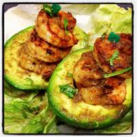Shrimp Stuffed Avocado · Whole avocado stuffed with grilled shrimp and special mojo sauce.