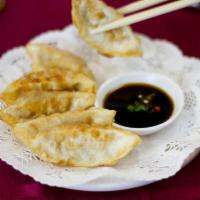 7. Pan Fried Dumplings · Dumpling filled with chicken, cabbage, onion and spices. Served with special sauce.