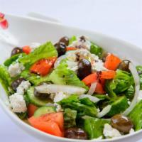 Greek Salad · Lettuce, tomato, shallots, feta cheese, black olives, olive oil, lemon juice and onion.