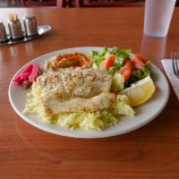 Grilled Mahi Mahi Fish · Marinated and grilled mahi mahi with lemon, onion, tomato, and jalapeño.